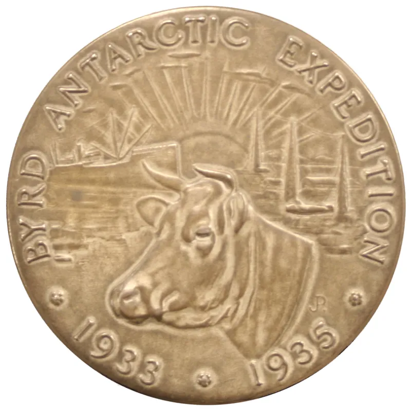 A real medal celebrating the cows’ expedition. A keepsake from their adventure, not a baby photograph.